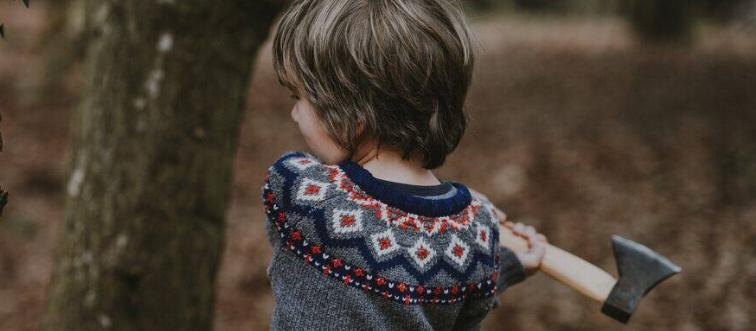 Child swinging a hatchet