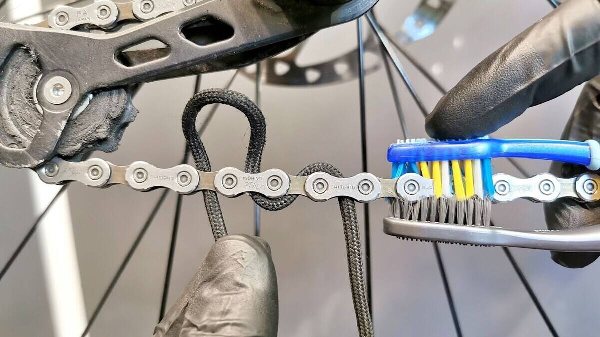 Cleaning bike chains with toothbrushes