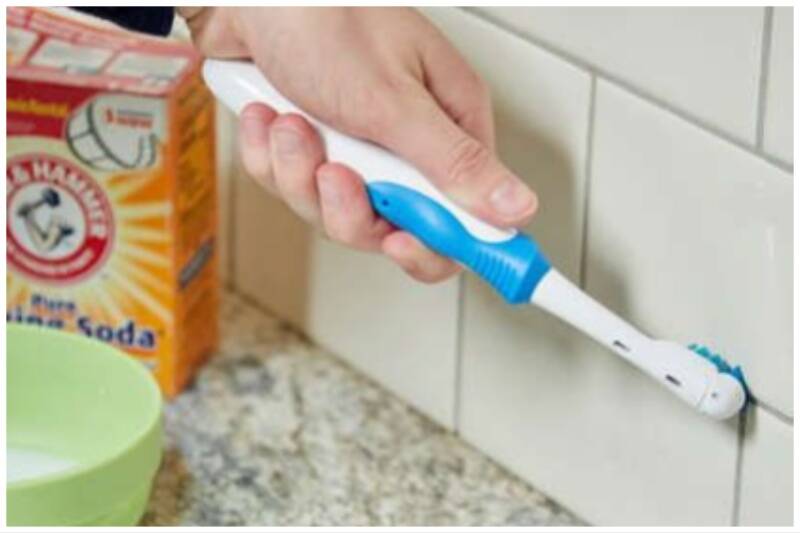 Cleaning tiles with toothbrushes