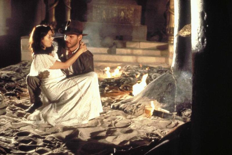 Harrison Ford and Karen Allen holding each other in Raiders Of The Lost Ark