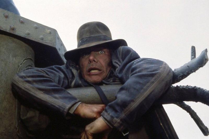 Harrison Ford hanging onto machine in Indiana Jones and The Last Crusade