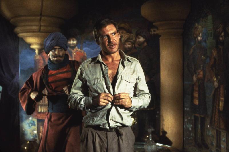 Harrison Ford taking shirt off in Indiana Jones And the Temple Of Doom