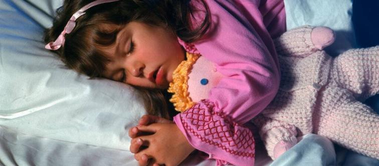 Young girl with her doll