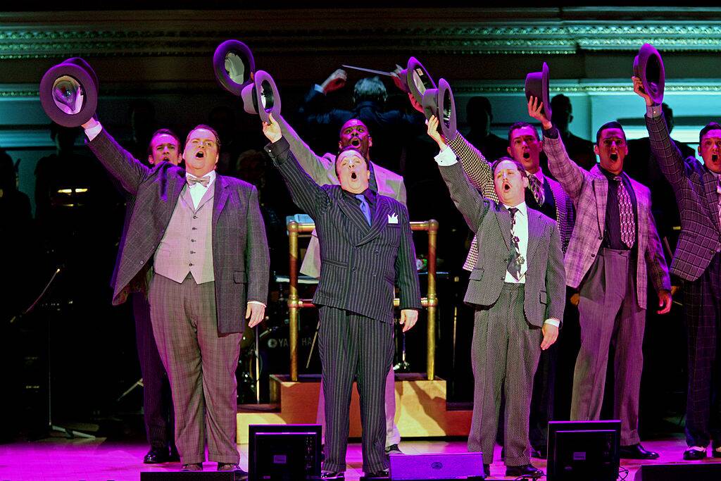 men in suits holding up their hats