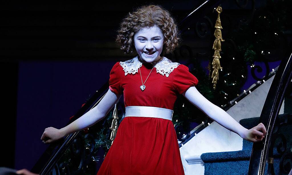 girl with red hair and a red dress