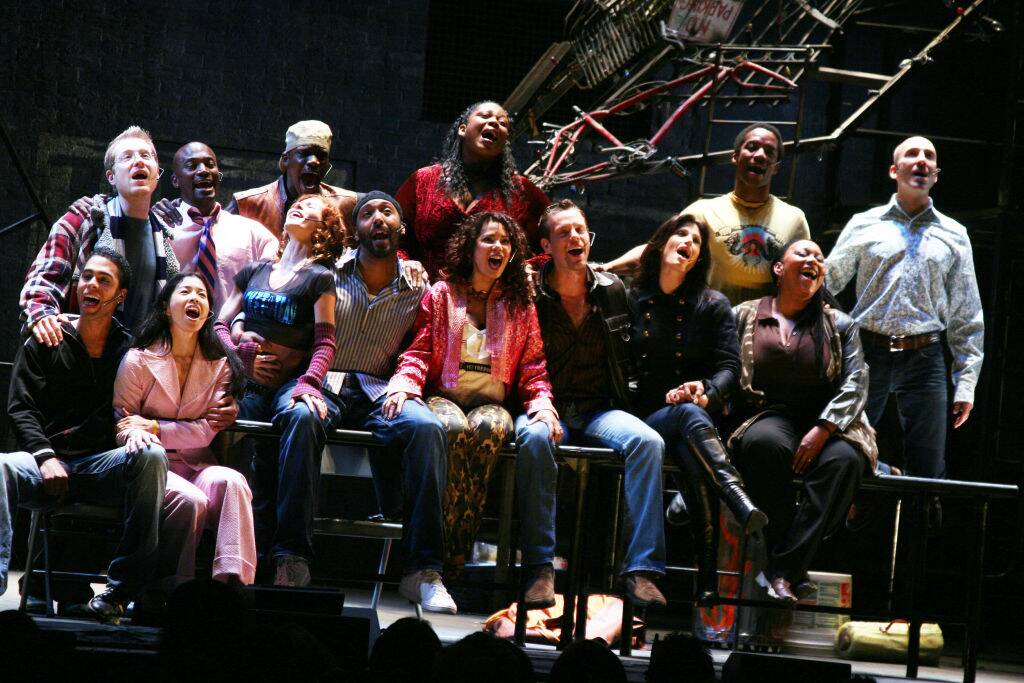 broadway cast performing on stage