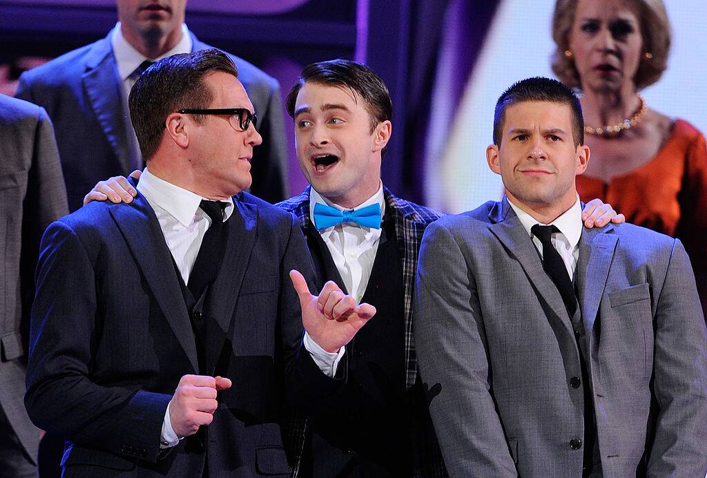men singing on stage