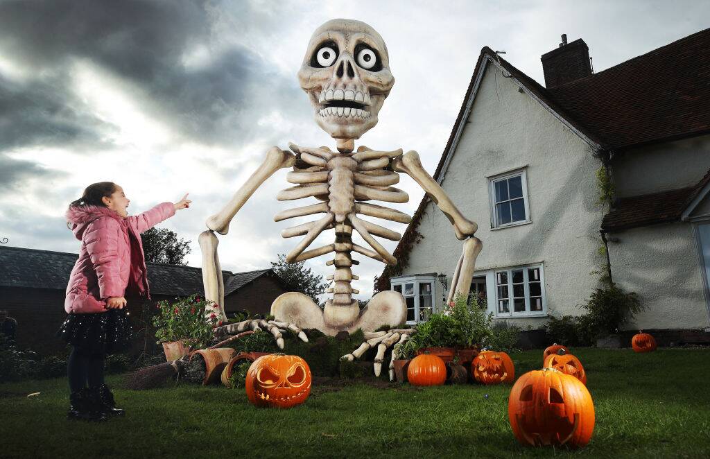 girl looking at giant skeleton