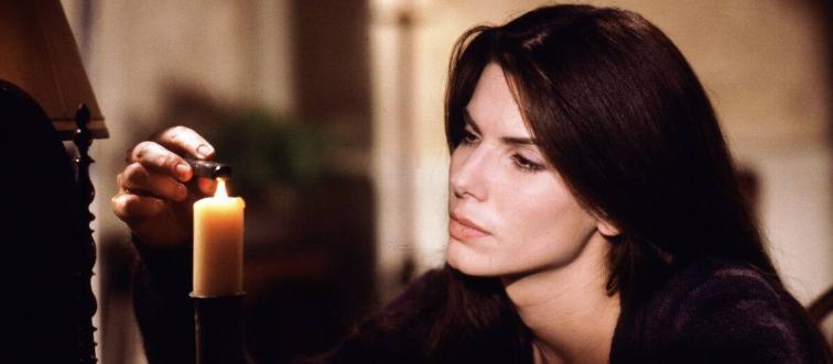 sandra bullock lighting a candle