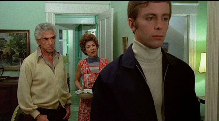 young man with his parents