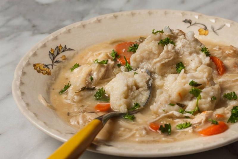 chicken and dumplings 904081490 chicken and dumplings in a stew with carrots and parsley