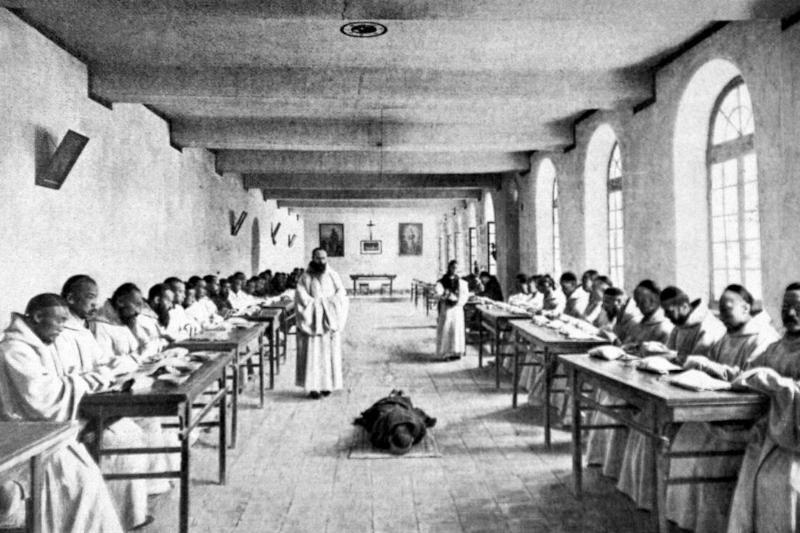 China, 1910, A Trappist monastery, 150 km West from Peking, At the refectory, after confessing his misdeed, a Trappist monk motifies himself during the meal.