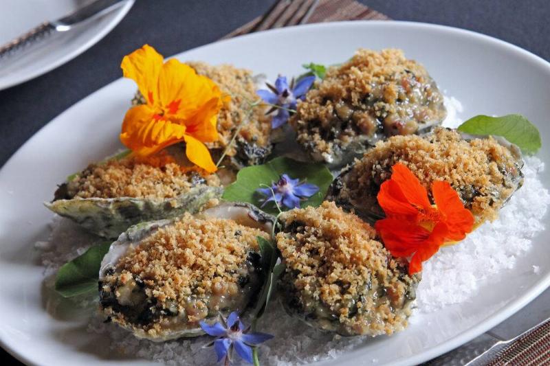 oysters rockefeller 1371563629 oysters rockefeller on a plate with colorful flowers