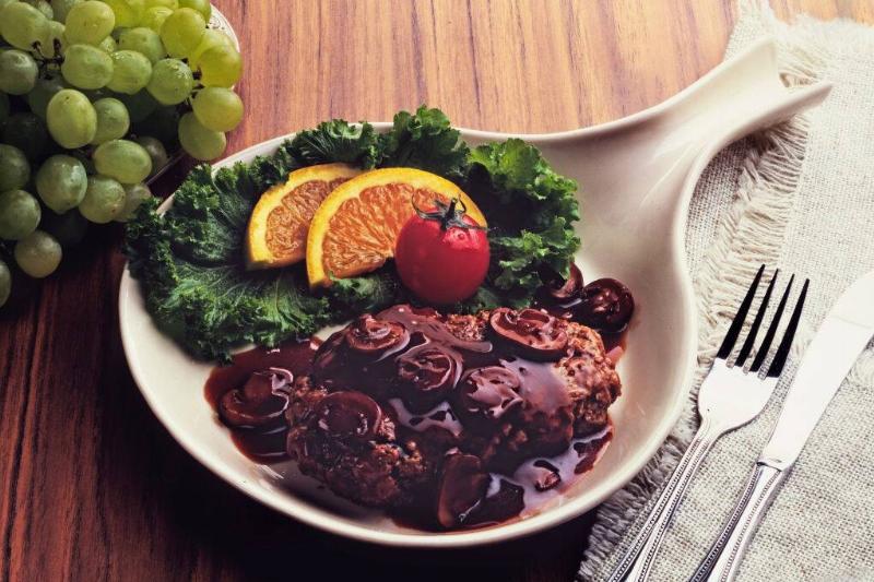 salisbury steak 469544933 Salisbury steak with mushrooms on white plate with garnish
