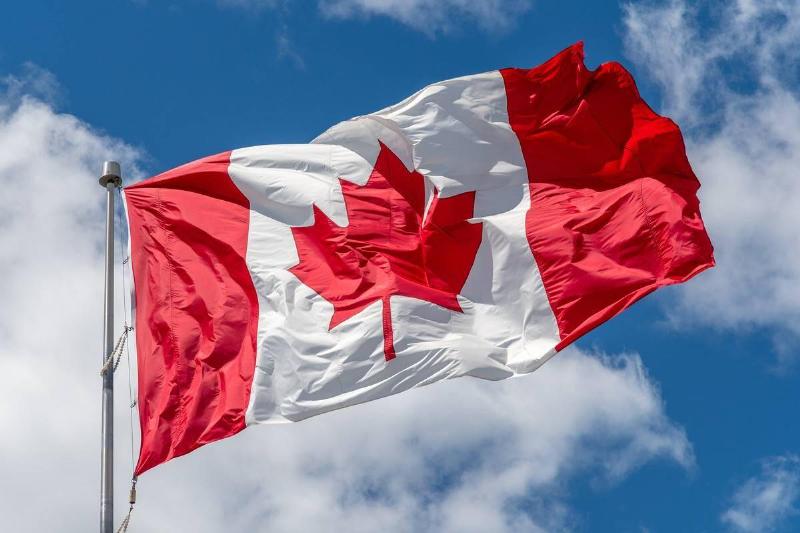 canadian-national-flag-waving-on-a-clear-sunny-day.-76086 canadian-national-flag-waving-on-a-clear-sunny-day.-76086