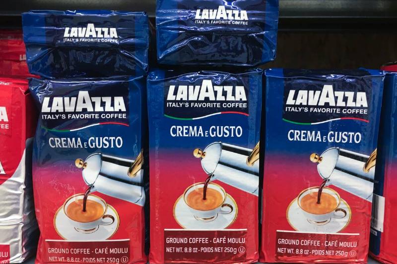 Packs of Lavazza powdered coffee stacked on a shelf. Luigi... Packs of Lavazza powdered coffee stacked on a shelf. Luigi...