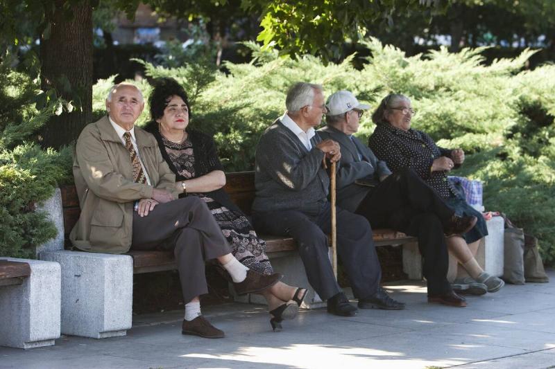 Old people on a bench in Yuzhen Park, Sofia, Bulgaria