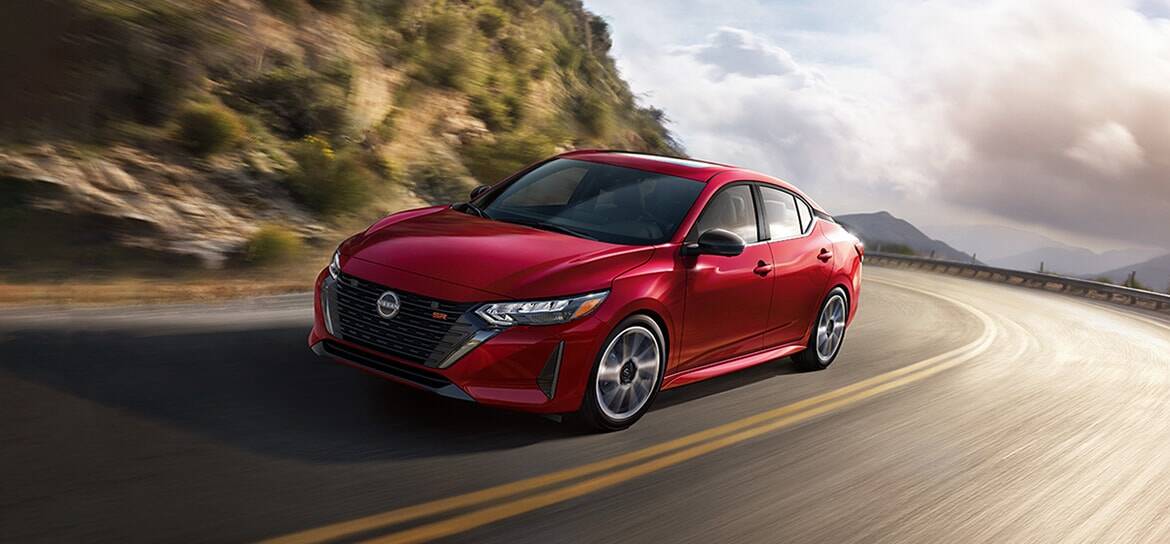 2024-nissan-sentra-red-taking-mountain-curve-speed