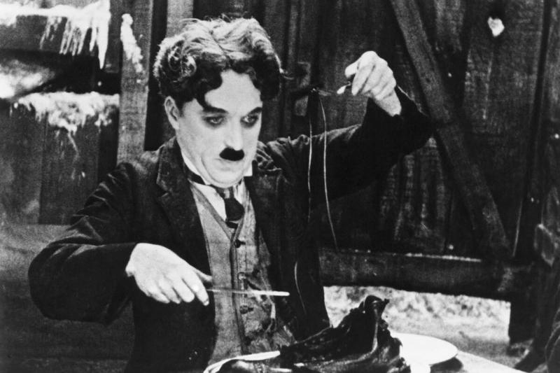 Charlie Chaplin in the Shoe-Eating Scene from The Gold Rush.