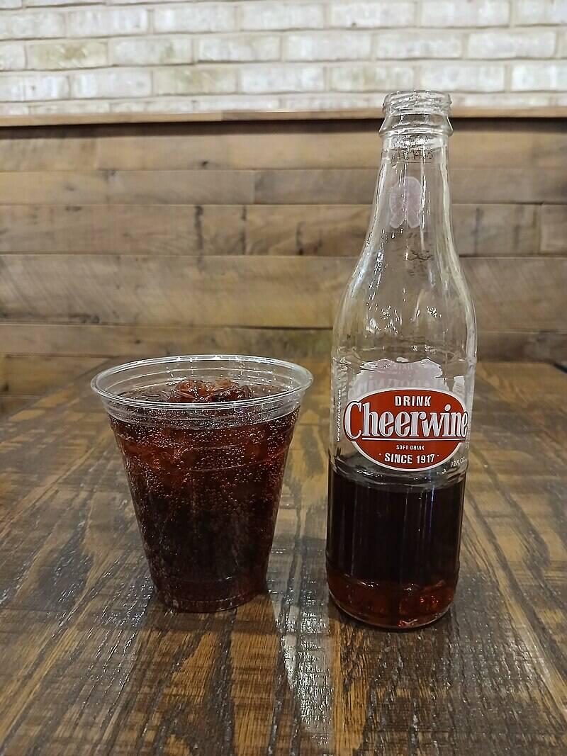 Bottle_and_plastic_cup_of_Cheerwine_at_dinner