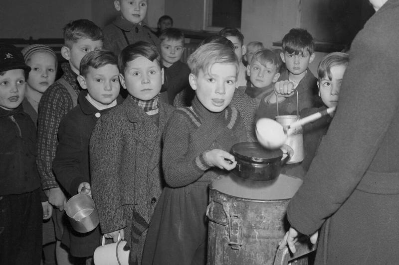 Young Children Waiting in Food Line