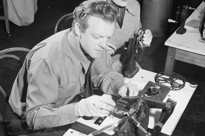 Movie Star Splicing Film with Assistant