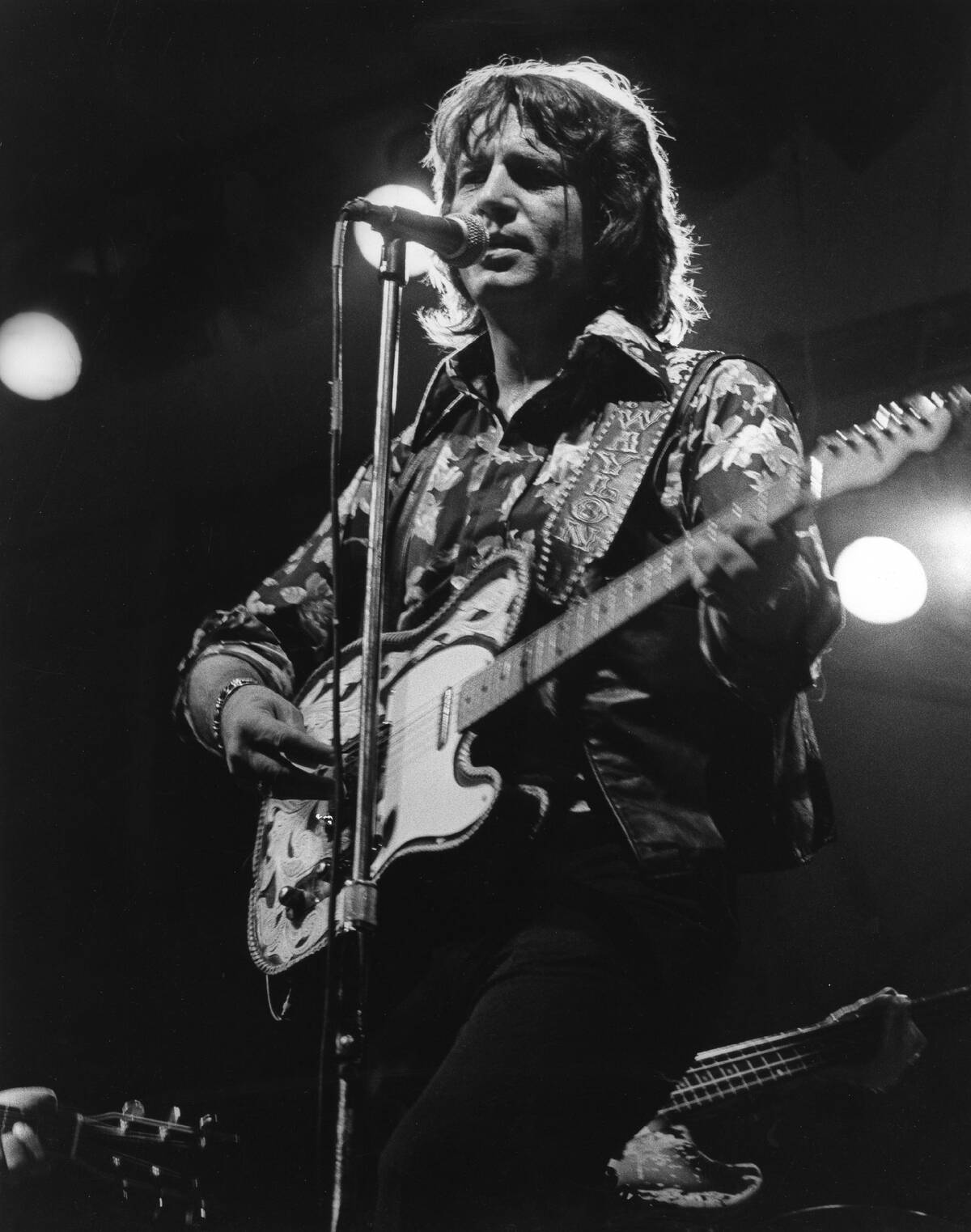 Waylon Jennings performing on stage