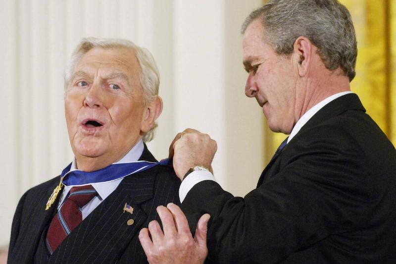 US President George W. Bush presents the