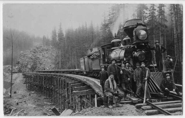 Railroad_construction_workers_and_locomotive