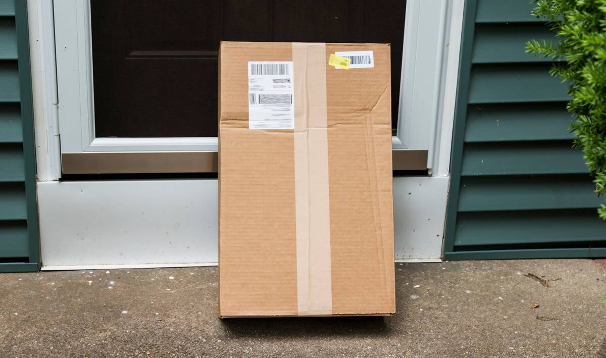 homesecurity6 A large package stood vertically in front of a door on a concrete porch.