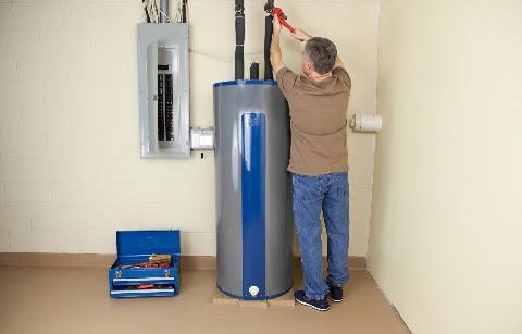 Man fixing water heater.