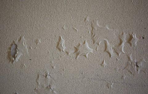 Moisture under paint.
