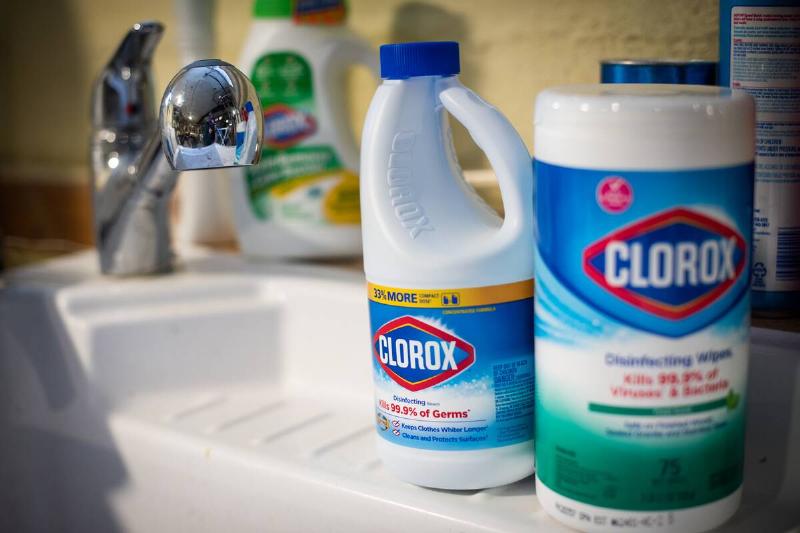 Clorox Bleach and Disinfecting Wipes on a bathroom sink.