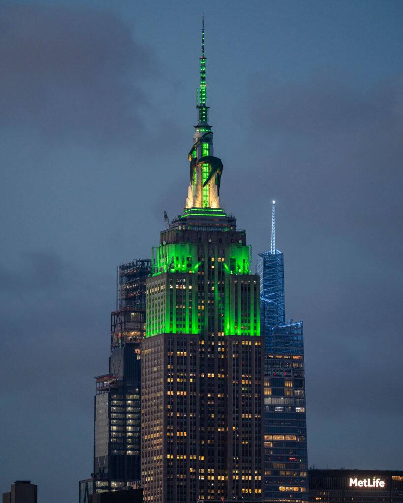 Empire State Building lit up in green