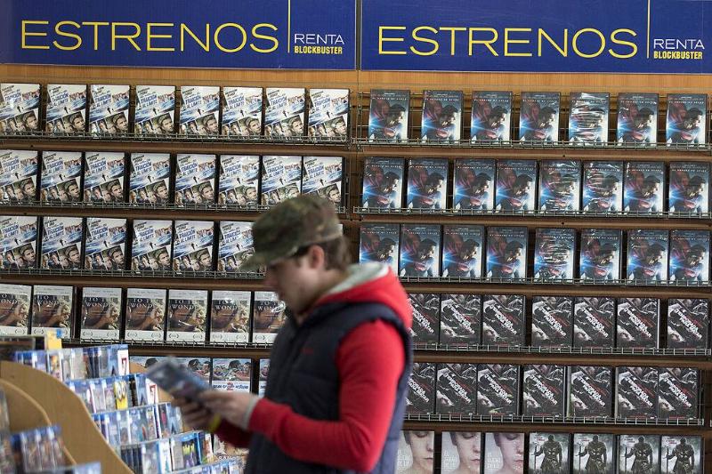 Man standing in the middle of a Blockbuster store