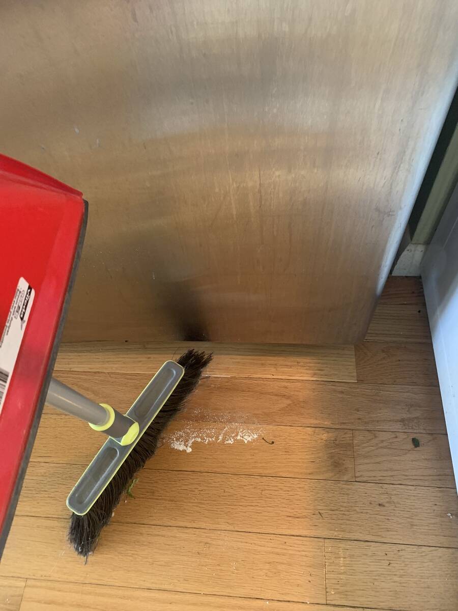 Sweeping up fallen flour.