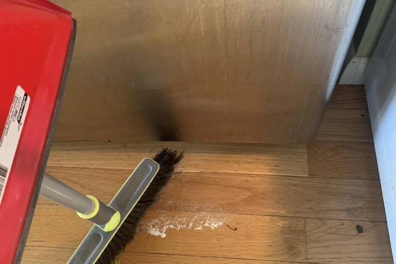 IMG_1008 Sweeping up fallen flour.