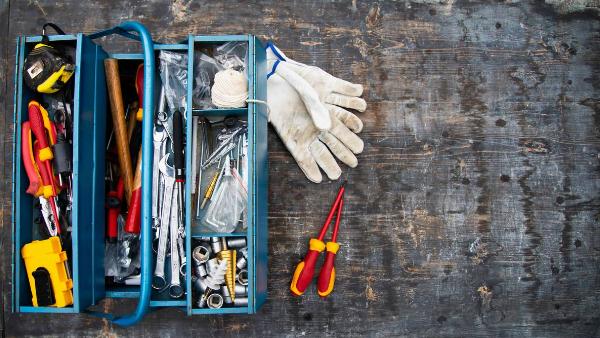 Box of tools and gloves.