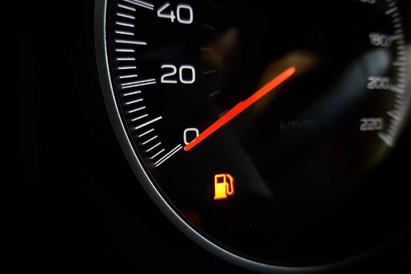 close-up-image-of-low-fuel-lamp-on-dashboard-in-ca-2025-03-09-00-23-13-utc Low fuel light symbol.