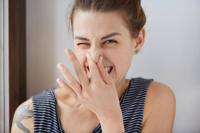 close-up-shot-of-caucasian-girl-showing-disgust-p-2025-01-23-23-52-21-utc Woman smelling stinky smell.