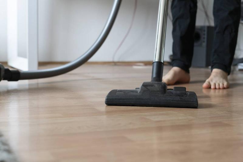 doing-a-clean-up-at-home-using-vacuum-cleaner-to-2025-01-26-23-43-09-utc Man vacuuming floors.