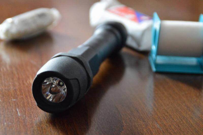 Emergency flashlight on table.