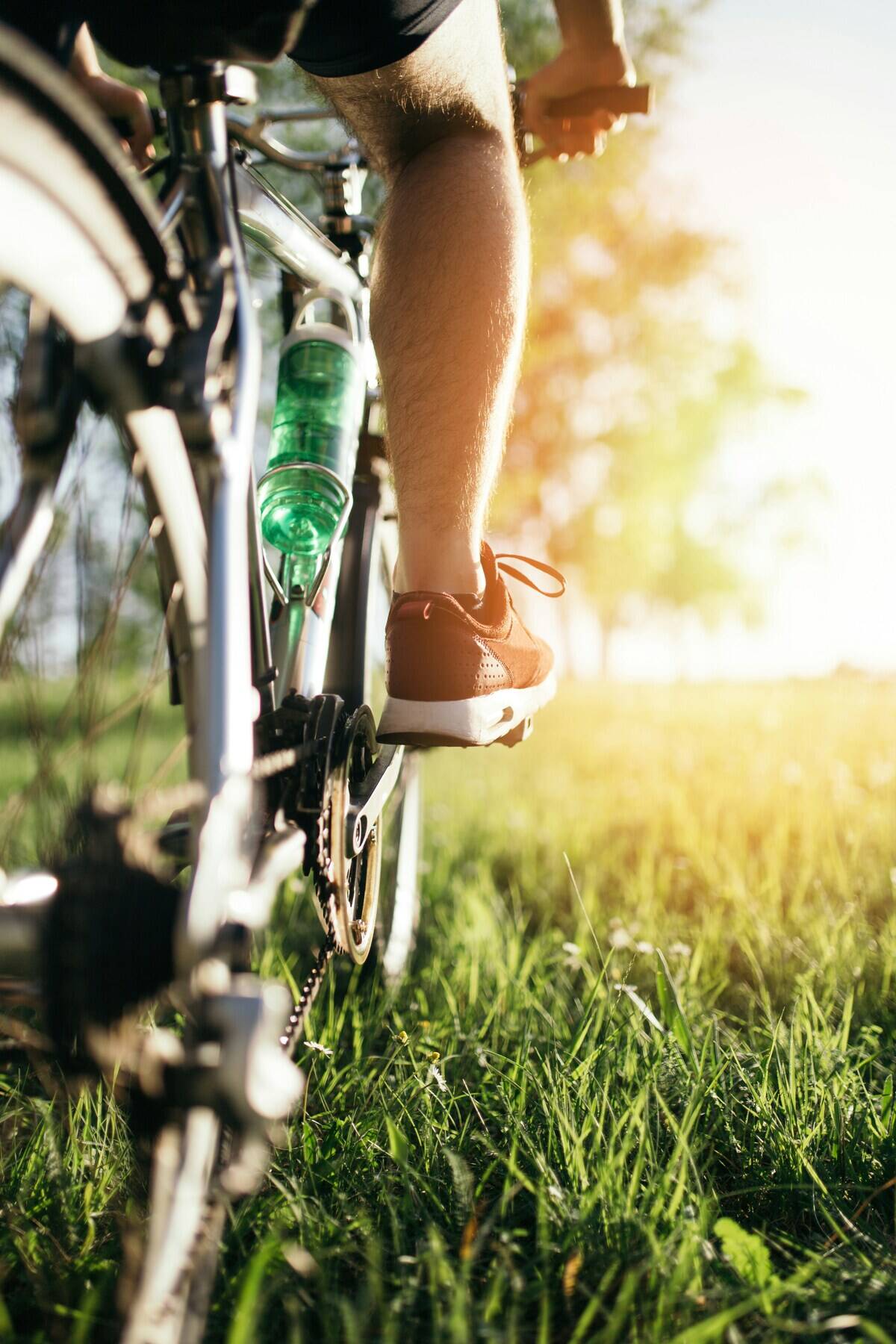 Close-up of someone biking on grass