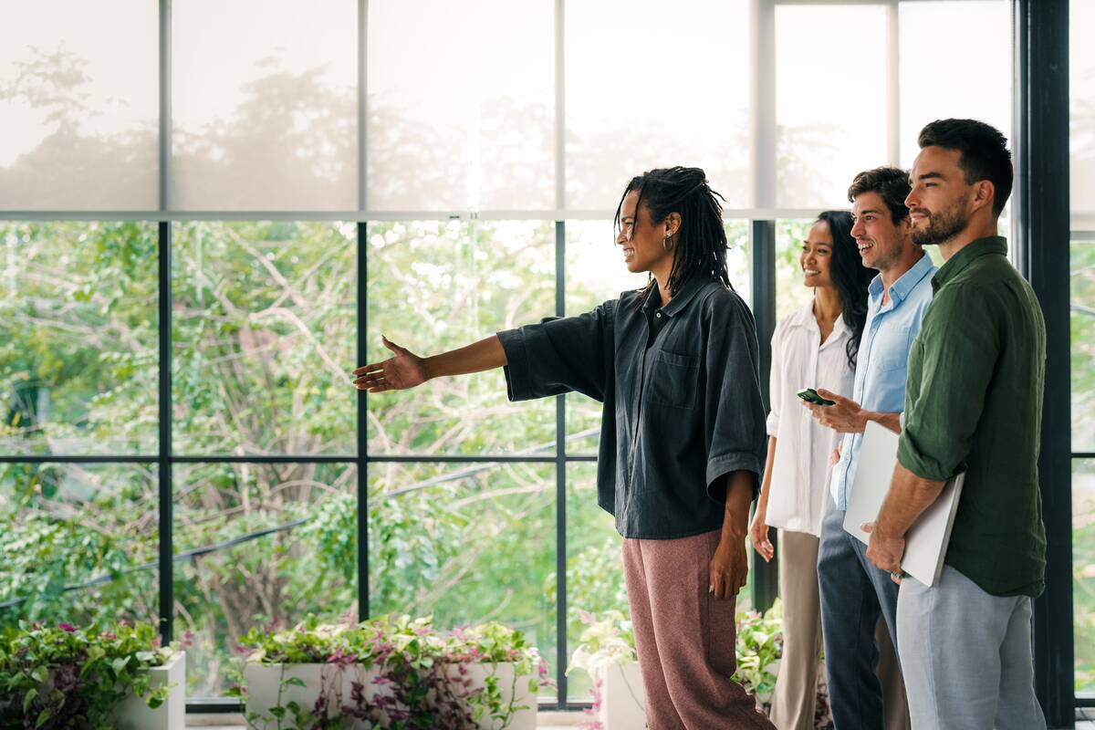 Woman showing how smart blinds work.