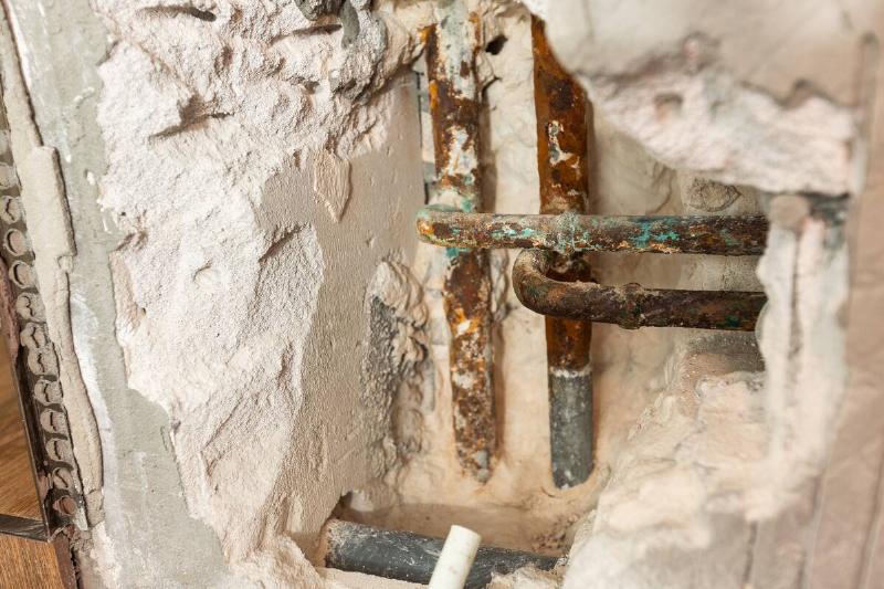 home-residential-problem-damage-water-piping-syst-2025-01-07-07-09-52-utc Water damage from leaky pipes behind house walls.