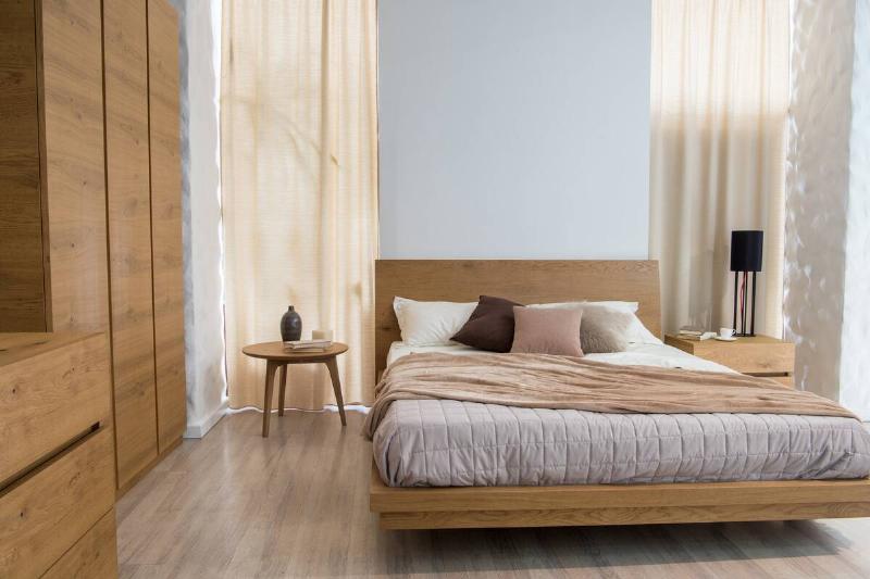interior-of-cozy-bedroom-with-closet-and-bed-in-mo-2024-11-17-06-34-37-utc A low bed in a small bedroom.