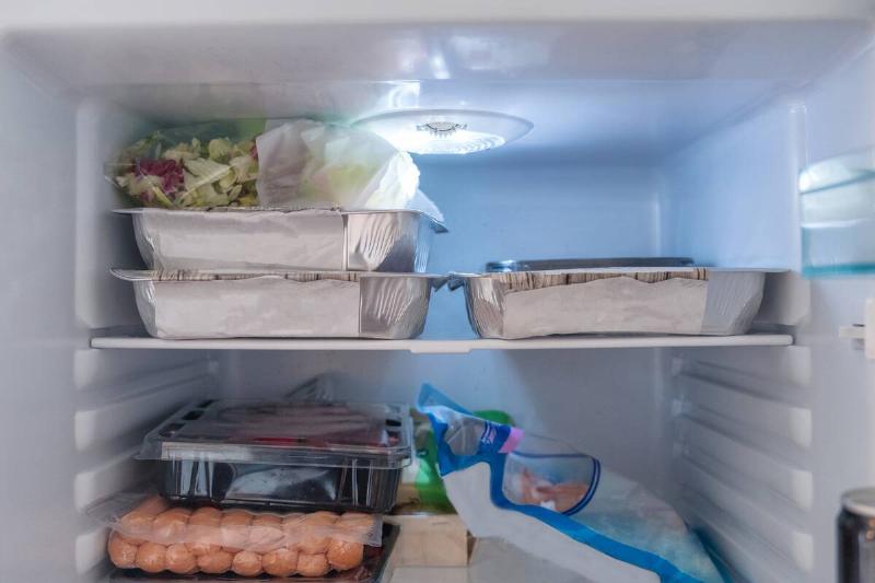 A refrigerator filled with leftover food.