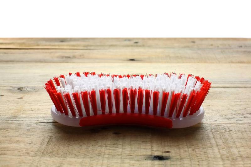 Plastic scrub brush.
