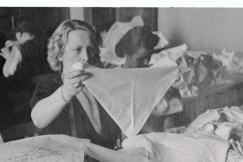 relief-worker-making-diapers-from-flour-sacks.-23392