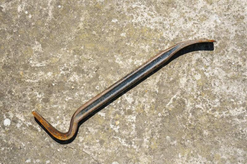 A steel crowbar tool.